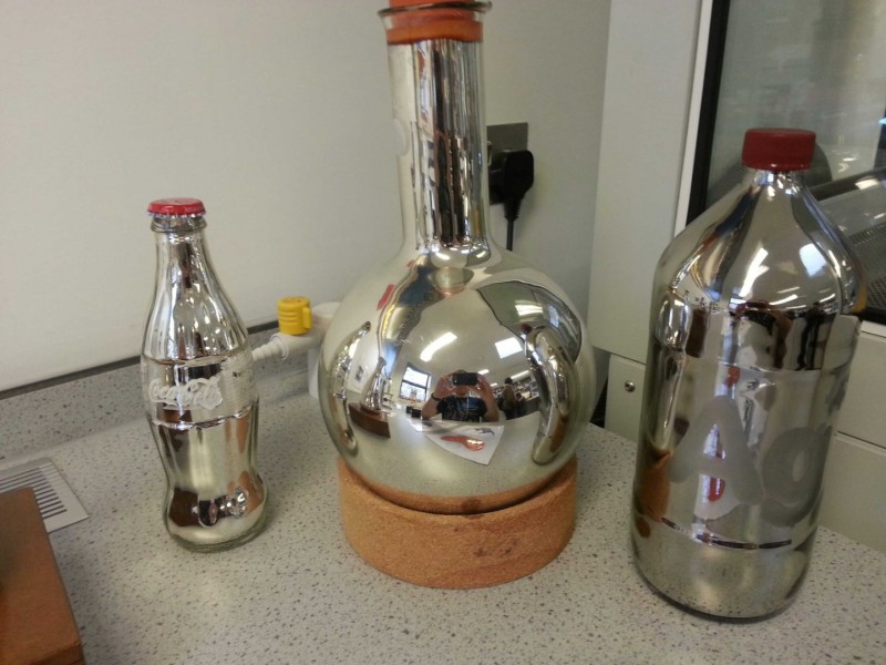 collection of silver mirrored bottles